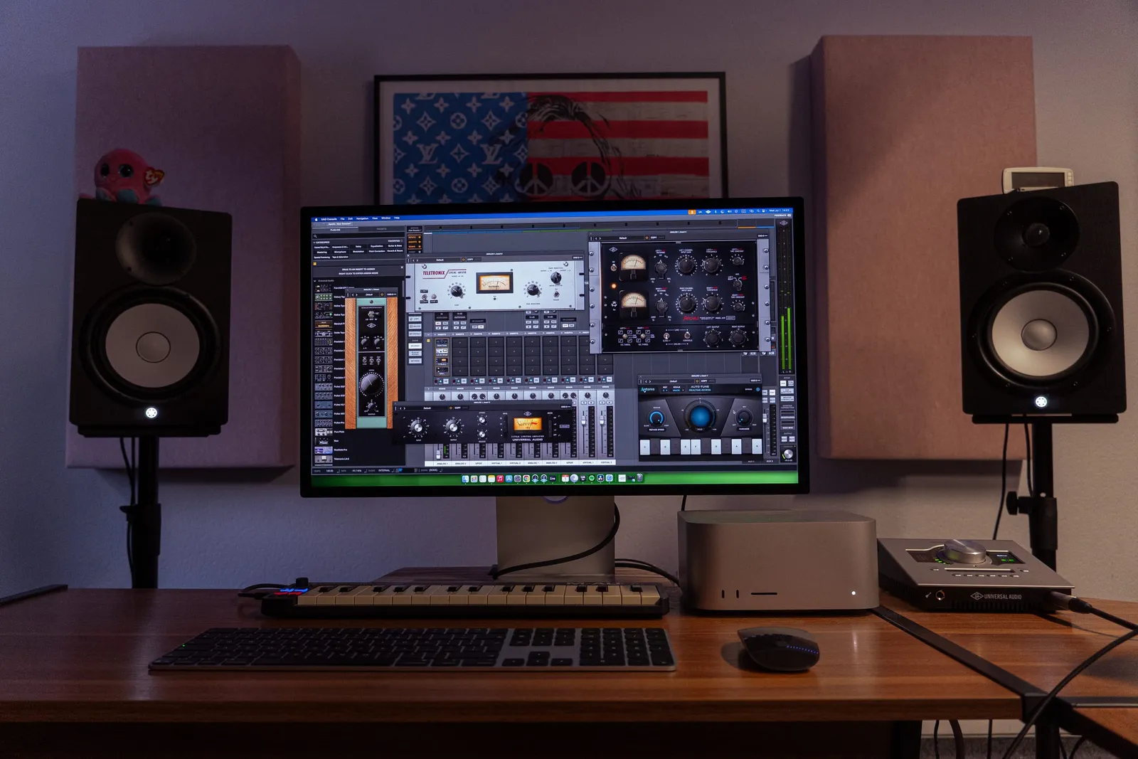 Studio control room desk with monitors and audio interface